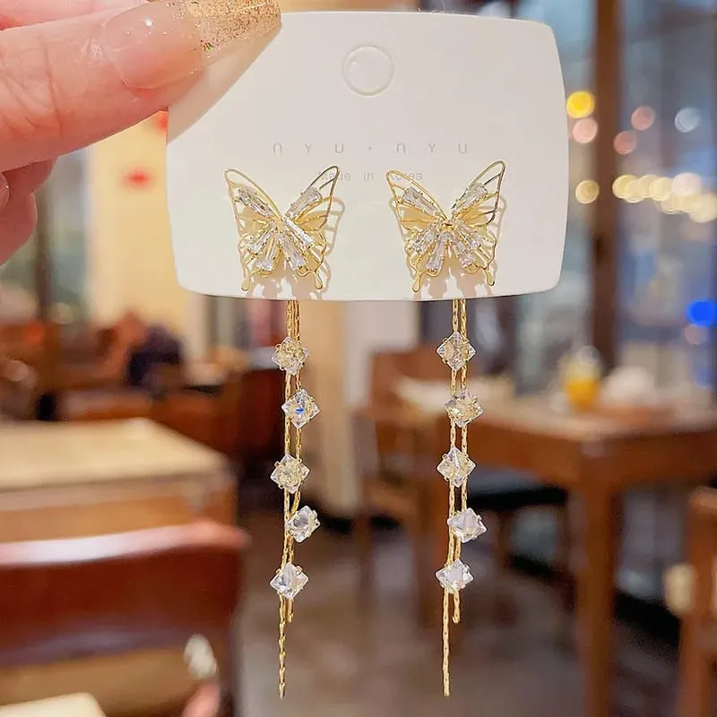 Aretes diseño mariposa con borla 160930
