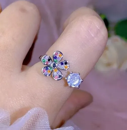 Anillo abierto con patron de flores y circonita  160937