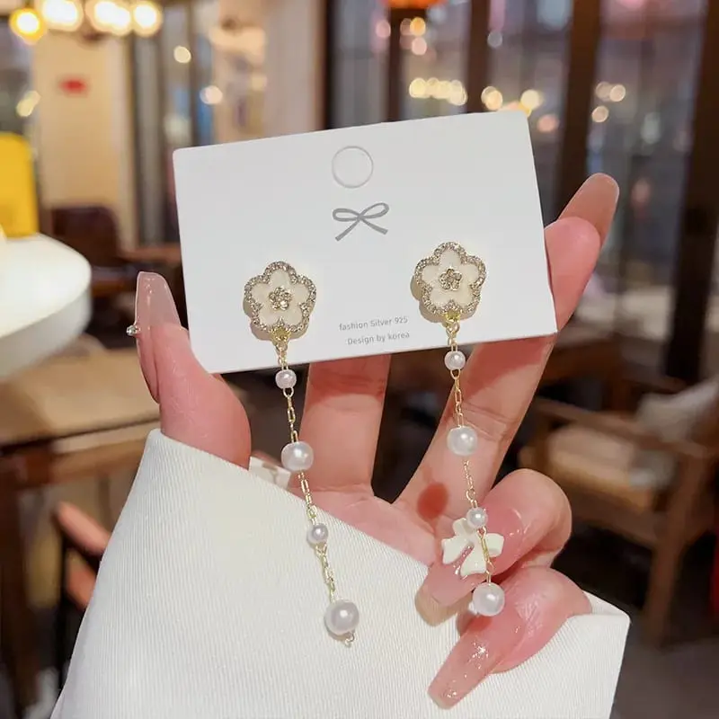 Aretes moño y 3 perlas fantasía 264717