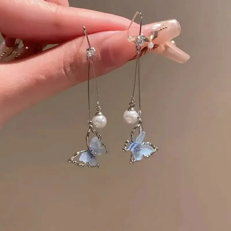 Aretes largos mariposa azul fantasía 264720