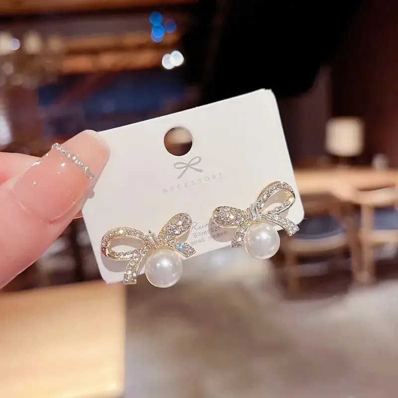 Aretes moño grande y perla fantasía 2642423