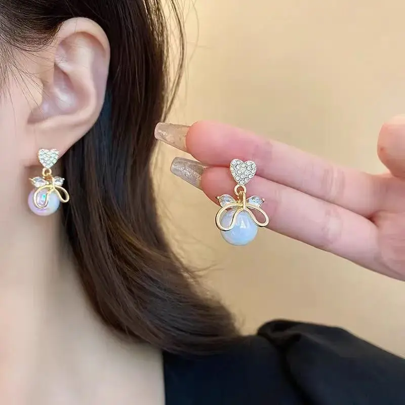 Aretes corazón con moño y perla fantasía 2642427
