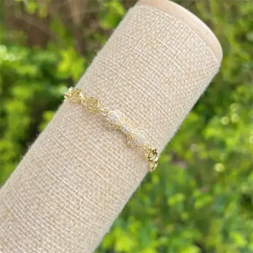 Pulsera moño dorado cobre chapeado 260112