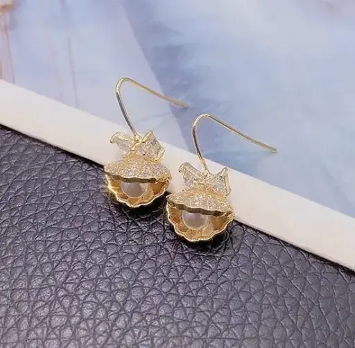 Aretes conchita dorada fantasía fina 260126