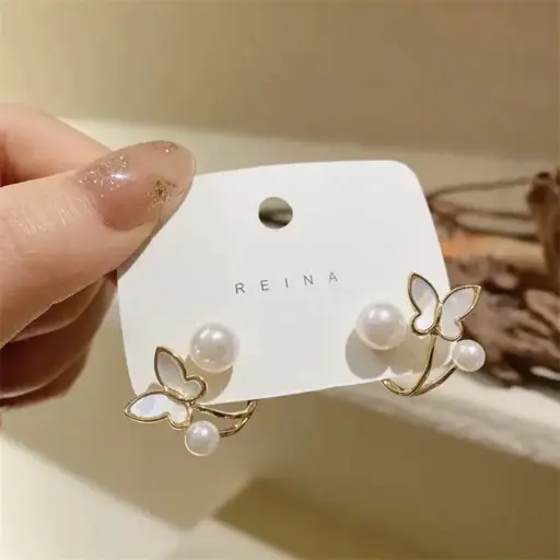 Aretes doble mariposa dorada con perla fantasía 2642404